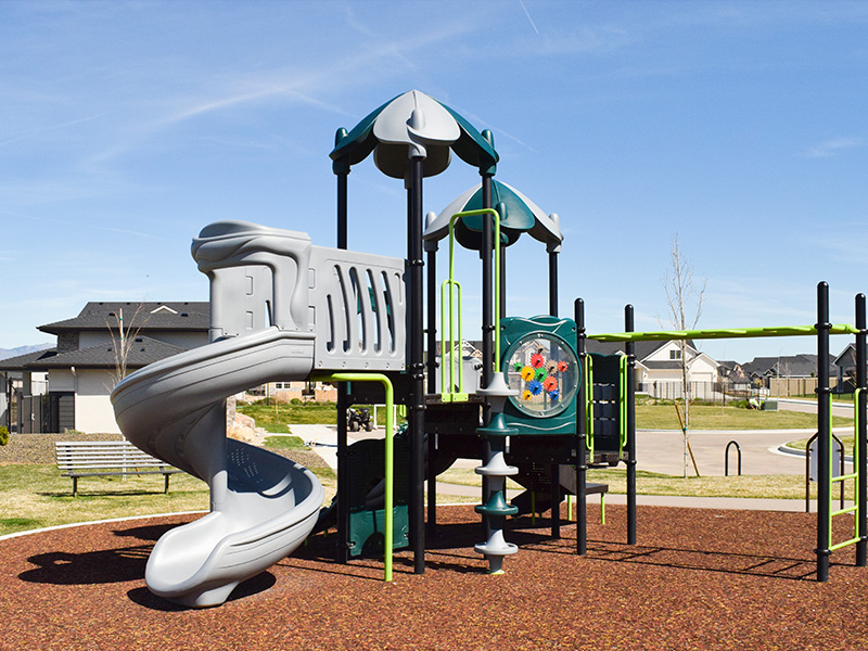Safe outdoor playground equipment with multiple slides and climbing rocks